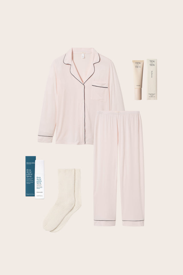 image of the TLC bundle featuring the Gisele TENCEL™ Modal
Long PJ Set in Sorbet Pink/Black, Heroine Hand Cream, Sleep Spray and Cozy Socks