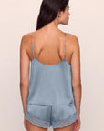 Model is wearing Inez Washable Silk Lace Cami & Short Set in Faded Denim/Faded Denim