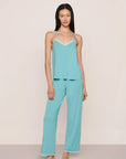 Model is wearing Frida TENCEL™ Modal Cami & Pant PJ Set in Blue Lagoon/Ivory