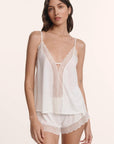 Model is wearing Lara TENCEL™ Modal Cami & Short PJ Set in Ivory