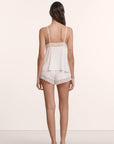 Model is wearing Lara TENCEL™ Modal Cami & Short PJ Set in Ivory