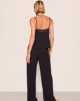 Model is wearing Kari TENCEL™ Modal Cami & Pant PJ Set in Black