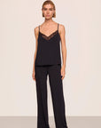 Model is wearing Kari TENCEL™ Modal Cami & Pant PJ Set in Black