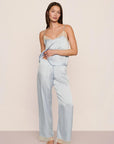 Model is wearing Washable Silk Lace Cami & Pant Set in Powder Blue/Champagne
