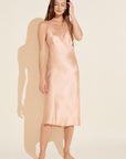Model wears Inez Washable Silk Slip Dress in Rose Cloud.