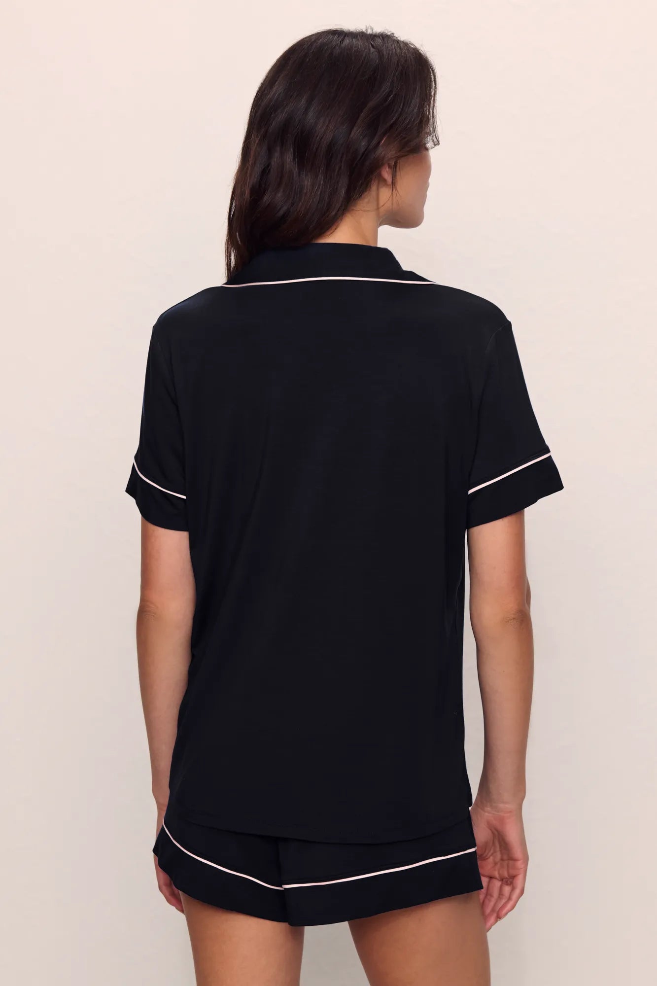 Model is wearing Gisele TENCEL™ Modal Relaxed Short PJ Set in Black/Sorbet Pink