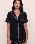Model is wearing Gisele TENCEL™ Modal Relaxed Short PJ Set in Black/Sorbet Pink