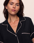 Model is wearing Gisele TENCEL™ Modal Relaxed Short PJ Set in Black/Sorbet Pink