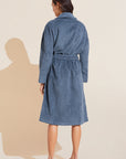 Model wears Terry Gender Neutral Robe in Coastal Blue.
