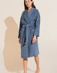 Model wears Terry Gender Neutral Robe in Coastal Blue.