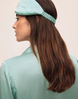 Model is wearing Inez Washable Silk Eye Mask in Canal Blue