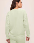 Model is wearing French Terry Sweatshirt in Matcha