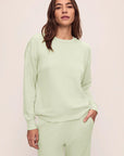 Model is wearing French Terry Sweatshirt in Matcha