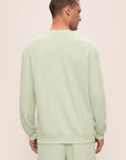 Model is wearing French Terry Sweatshirt in Matcha