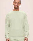 Model is wearing French Terry Sweatshirt in Matcha