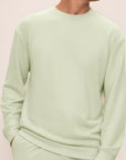 Model is wearing French Terry Sweatshirt in Matcha