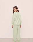 Model is wearing Kid's French Terry Sweatshirt and Jogger Set in Matcha