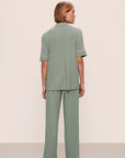 Model is wearing Gisele TENCEL™ Modal Short Sleeve & Pant PJ Set in Eucalyptus/Ivory