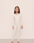 Model is wearing Kids Printed TENCEL™ Modal Unisex Long PJ Set in Heritage Stripe Lt Htr Grey/Pe