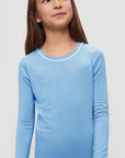 Model is wearing Kids TENCEL™ Modal Unisex Long PJ Set in Summer Blue/White