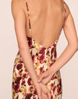 Model is wearing Inez Washable Silk Printed Slip in Botanical Flower Merlot