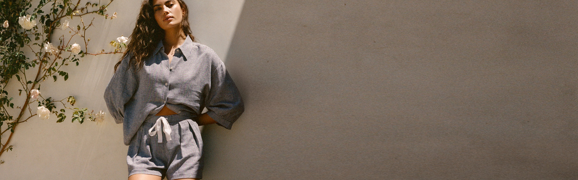 Model is wearing Linen Blend Relaxed Quarter Sleeve Top and Short in Gingham White/Navy