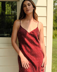 Model is wearing Inez Washable Silk Short Slip in Merlot Dot