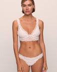 Model is wearing Mariana Thong in White