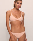 Model is wearing Pima Stretch Cotton Bralette in Buff