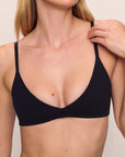 Model is wearing Pima Stretch Cotton Bralette in Black