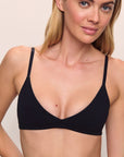 Model is wearing Pima Stretch Cotton Bralette in Black