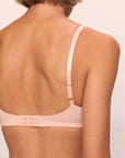 Model is wearing Pima Stretch Cotton Bralette in Buff
