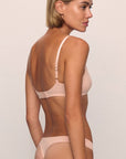 Model is wearing Pima Stretch Cotton Bralette in Buff