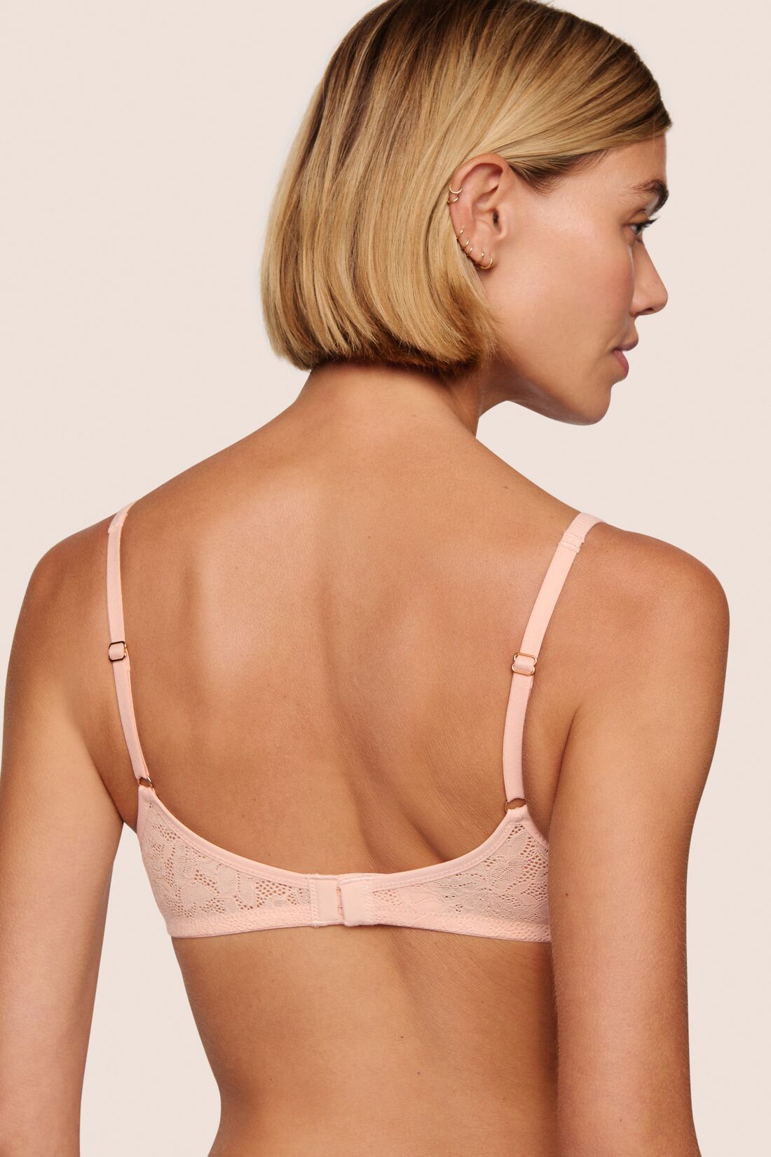 Model is wearing Soft Stretch Lace Plunge Bralette in Buff