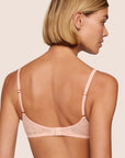 Model is wearing Soft Stretch Lace Plunge Bralette in Buff