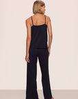 Model is wearing Gisele TENCEL™ Modal Cami & Pant PJ Set in Black