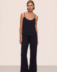 Model is wearing Gisele TENCEL™ Modal Cami & Pant PJ Set in Black