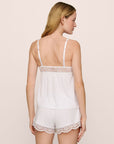 Model is wearing the Beatrix TENCEL™ Modal Cami & Short PJ Set in White
