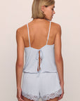 Model is wearing Mariana Romper in ice blue
