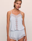 Model is wearing Mariana Romper in ice blue