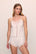 Model is wearing Mariana Romper in White
