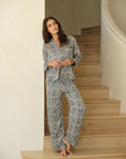 Model is wearing Eberjey x Casa Del Sol Inez Washable Silk Long PJ Set in Azulejos Navy/Navy
