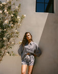 Model is wearing Linen Blend Relaxed Quarter Sleeve Top and Short in Gingham White/Navy