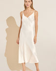 Model wears Inez Washable Silk Slip Dress in Ivory.