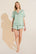 Model wears Inez Washable Silk Short PJ Set in Surf Spray/Agave.