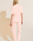 Model wears Gisele TENCEL™ Modal Short Sleeve & Pant PJ Set in petal pink/ivory.