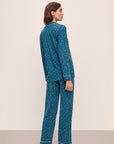 Model wears the Gisele Printed TENCEL™ Modal Long PJ Set in Festive Lights Sapphire/Ivory.
