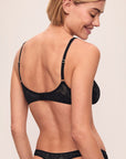 Model is wearing Soft Stretch Recycled Lace Triangle Bralette in Black