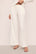 Model is wearing Gisele Tencel™ Modal Everyday Straight Leg Pant in Ivory