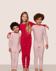 Kids wearing PJs in Duo Stripe Holly Red/Holly Red and Nutcracker Red/Ivory